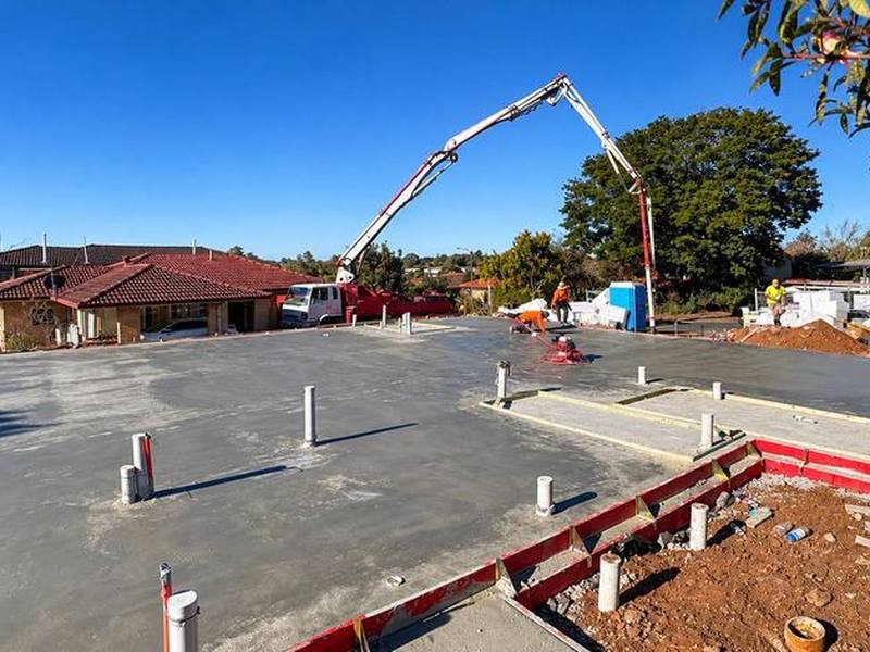 House slab being poured with a concrete pump