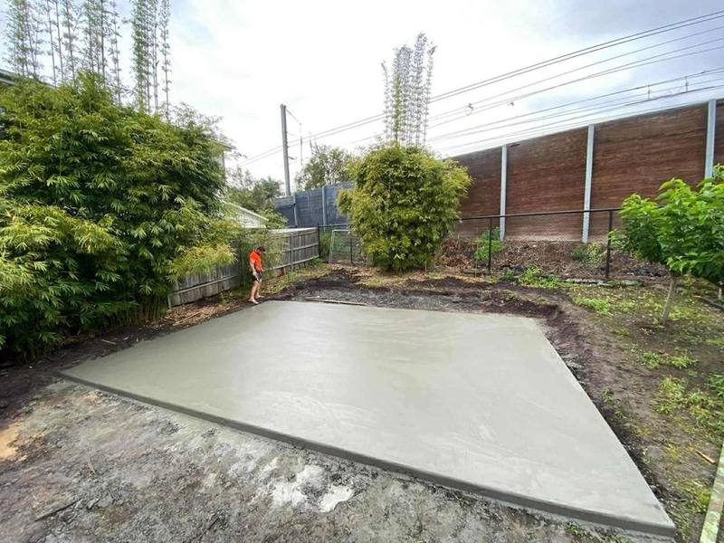 Freshly finished shed slab in a backyard